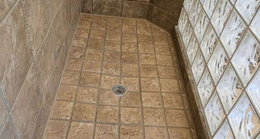 Finished tile and grout repair in a Kansas City shower by Bathroom Bidders