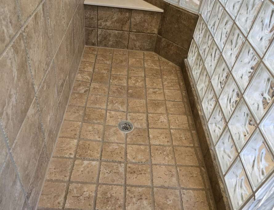 Finished tile and grout repair in a Kansas City shower by Bathroom Bidders